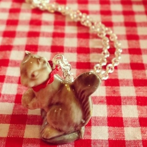 This necklace was inspired by a ceramic creature necklace in a shop which was about £20. Being the collector/hoarder that I am, I unearthed a squirrel from my childhood squirrel collection and glued him to a jump ring via a red ric rac necklace. Ta Da! Cute necklace win